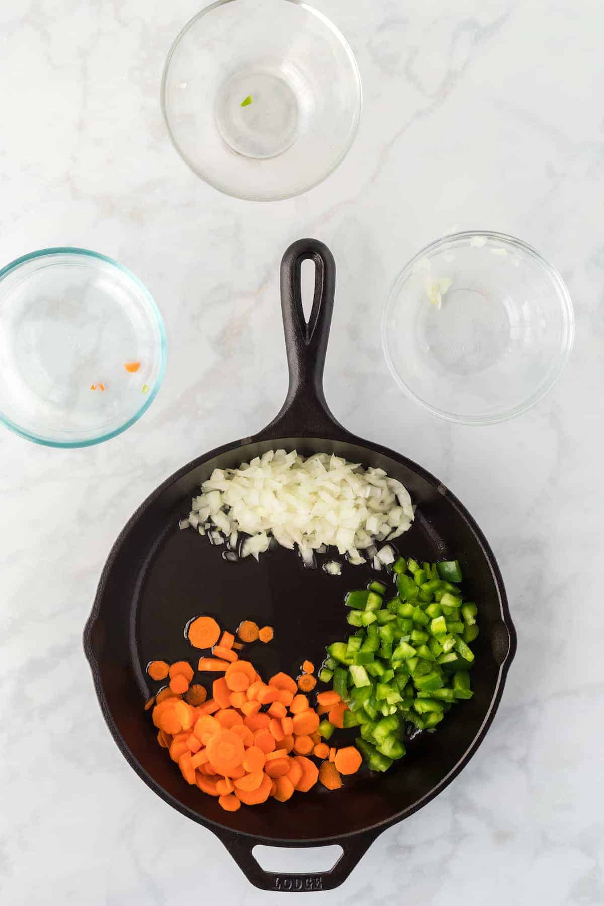 chopped veggies in a large cast iron skillet