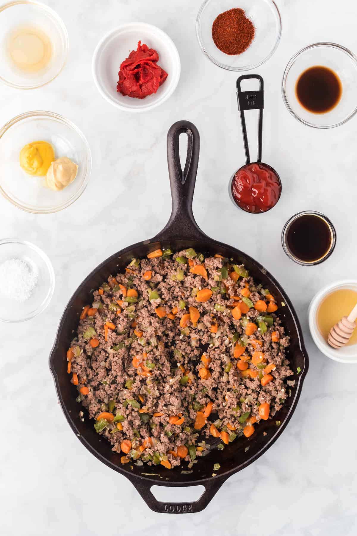 the cooked meat and veggies in a large cast iron skillet