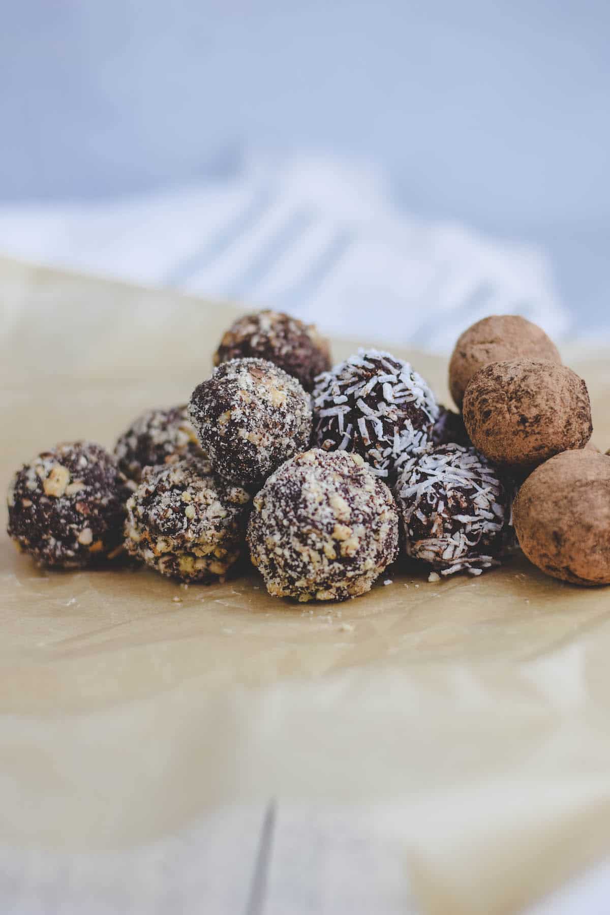 stack of dark chocolate truffles on parchment paper