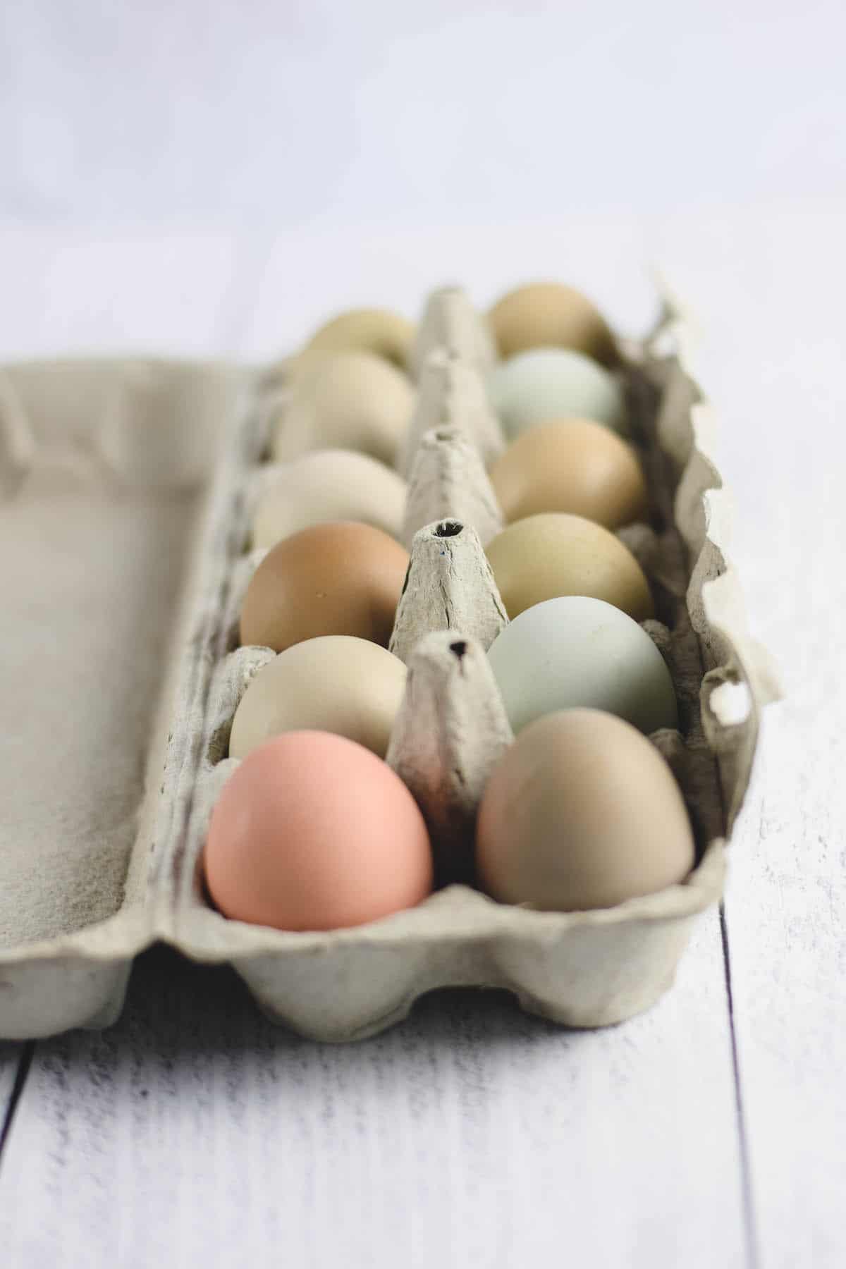 egg carton filled with a variety of colorful eggs