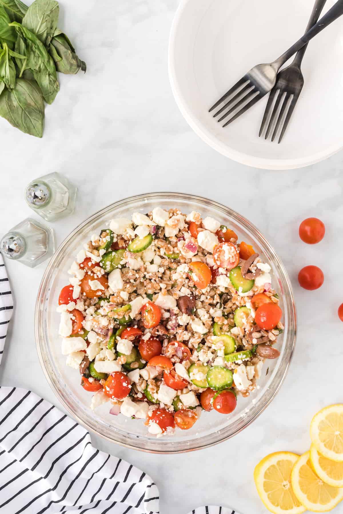 large serving bowl with the medierranean farro salad