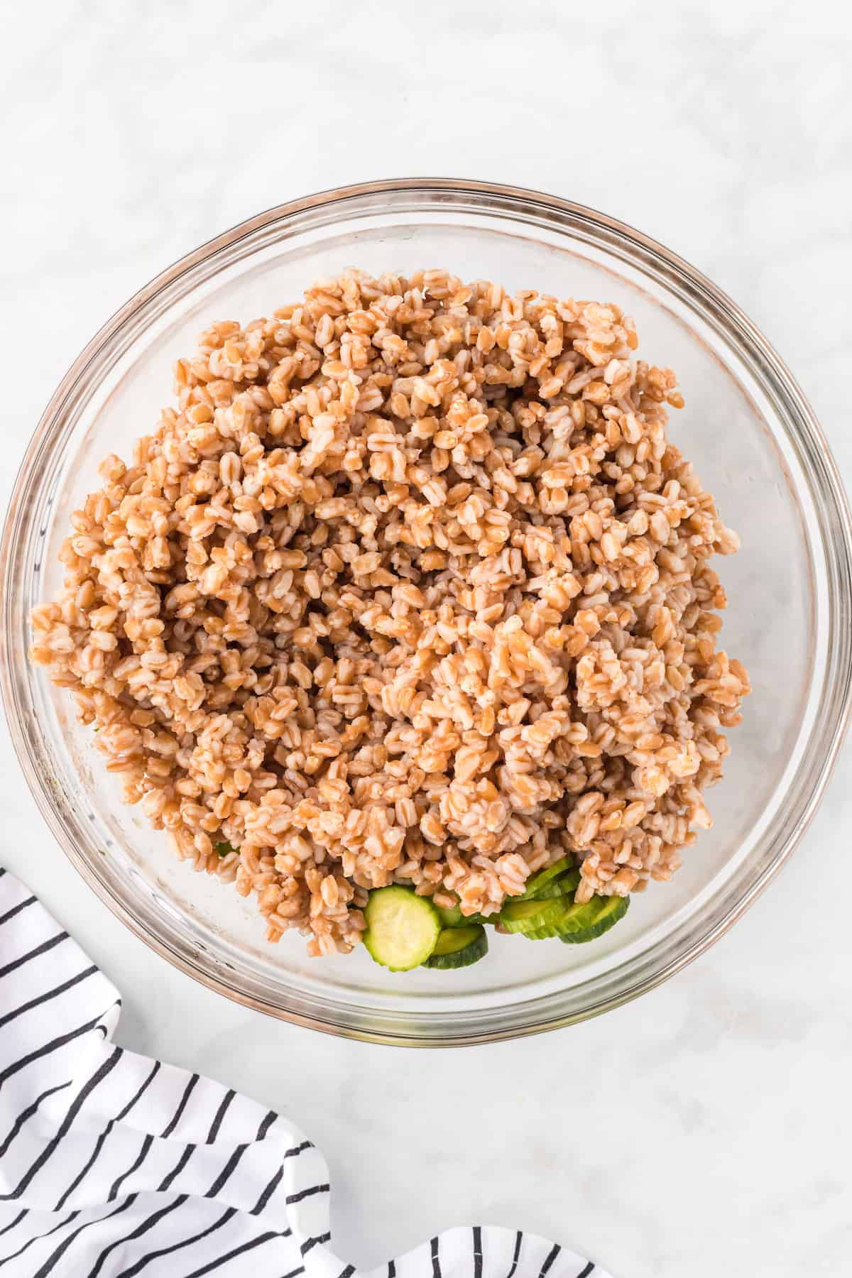 farro with the cucumbers in a large bowl.