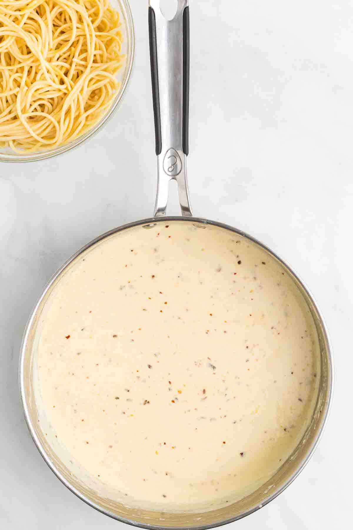 large skillet of creamy lemon sauce.