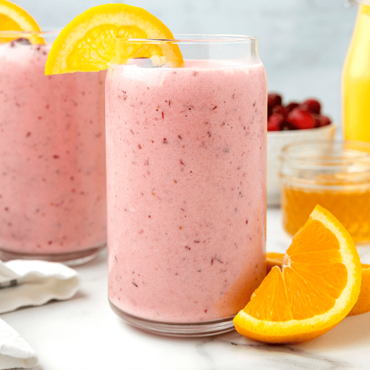 two glasses of the cranberry orange smoothie