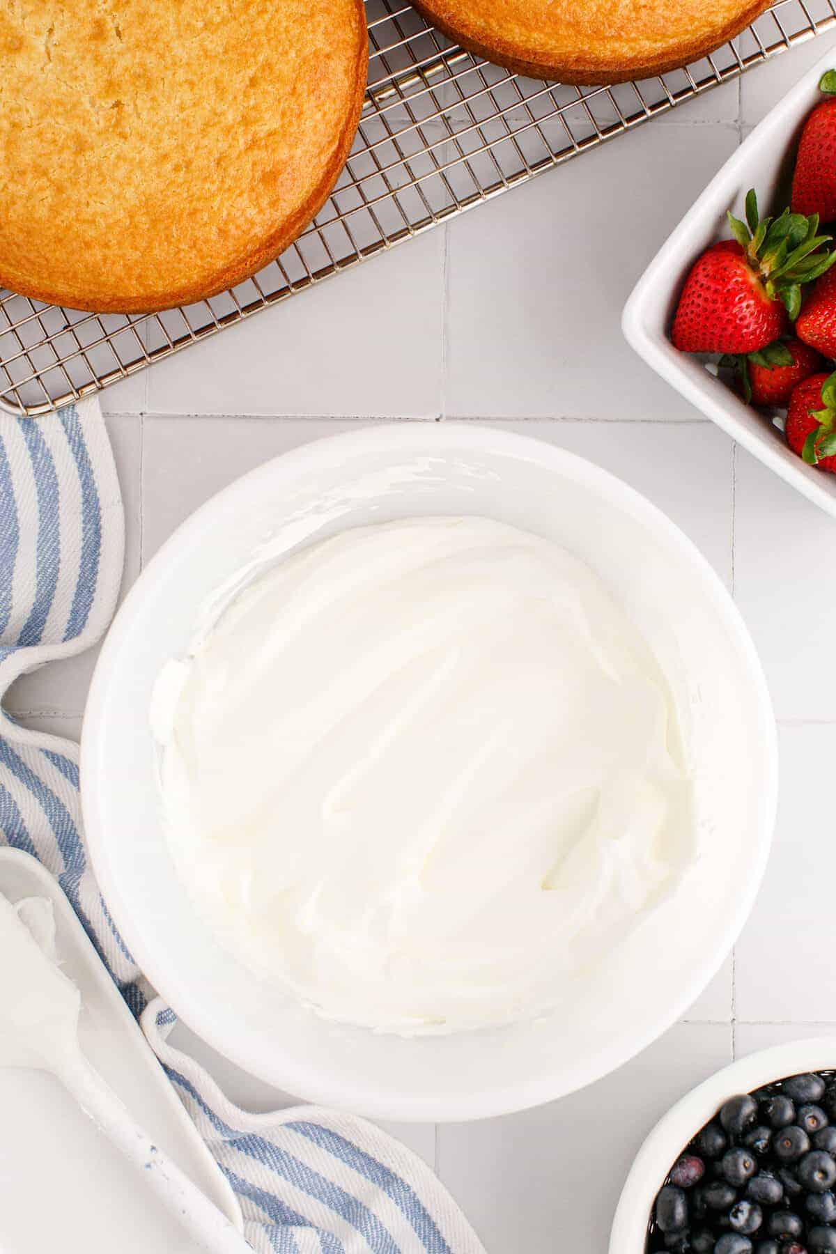 smooth pudding and whipped cream combined in a large white bowl. 