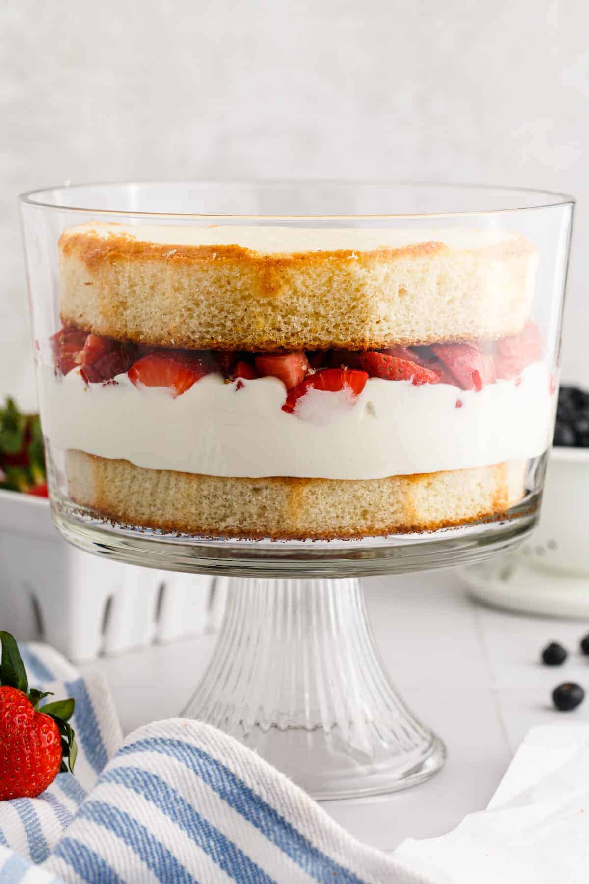 second cake layered on top of the fresh strawberries.