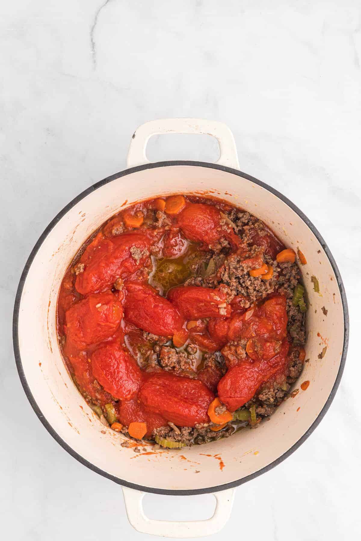 the San Marzano tomatoes in a dutch oven pot and combined with the veggies and browned ground beef. 