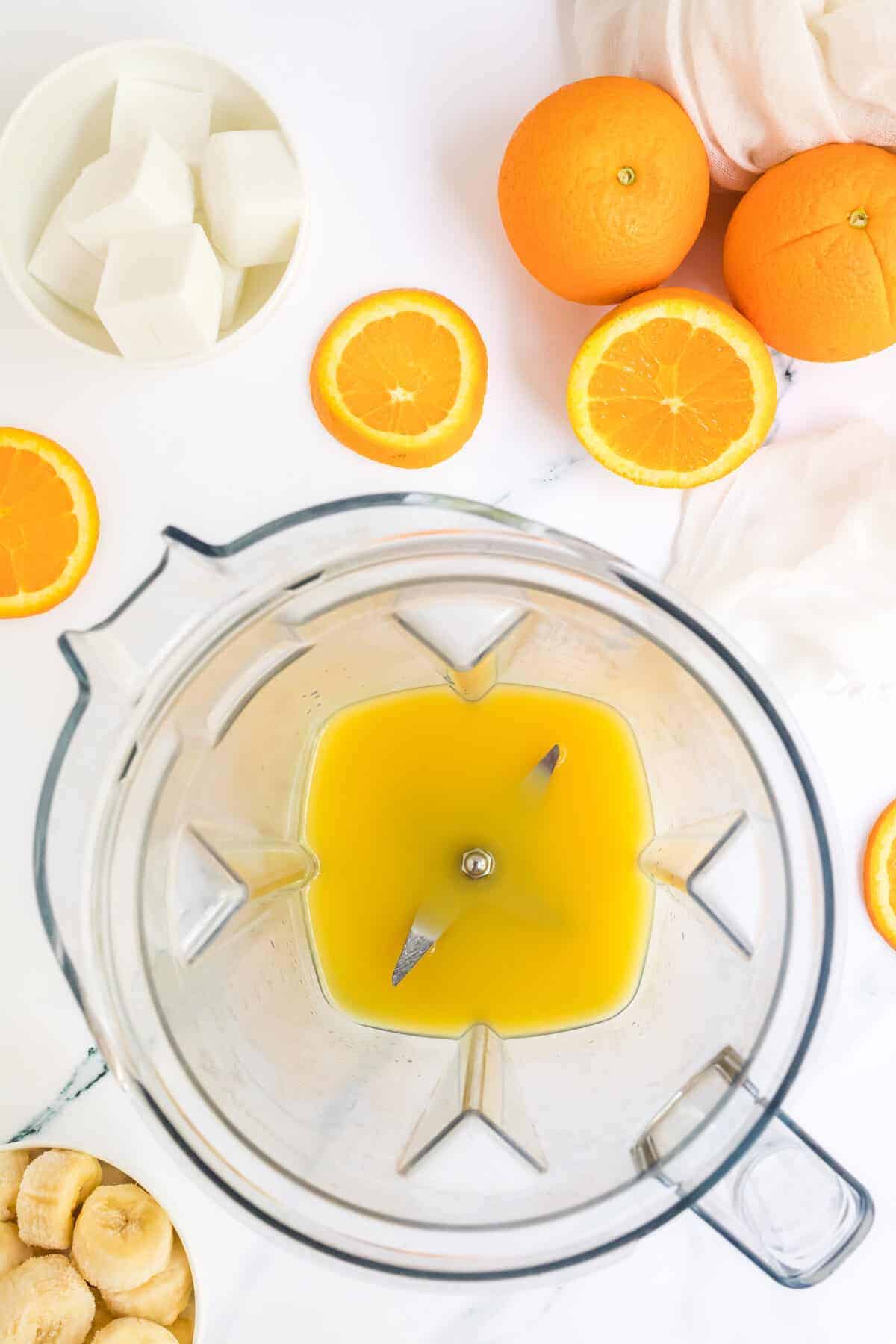 orange juice in a blender.