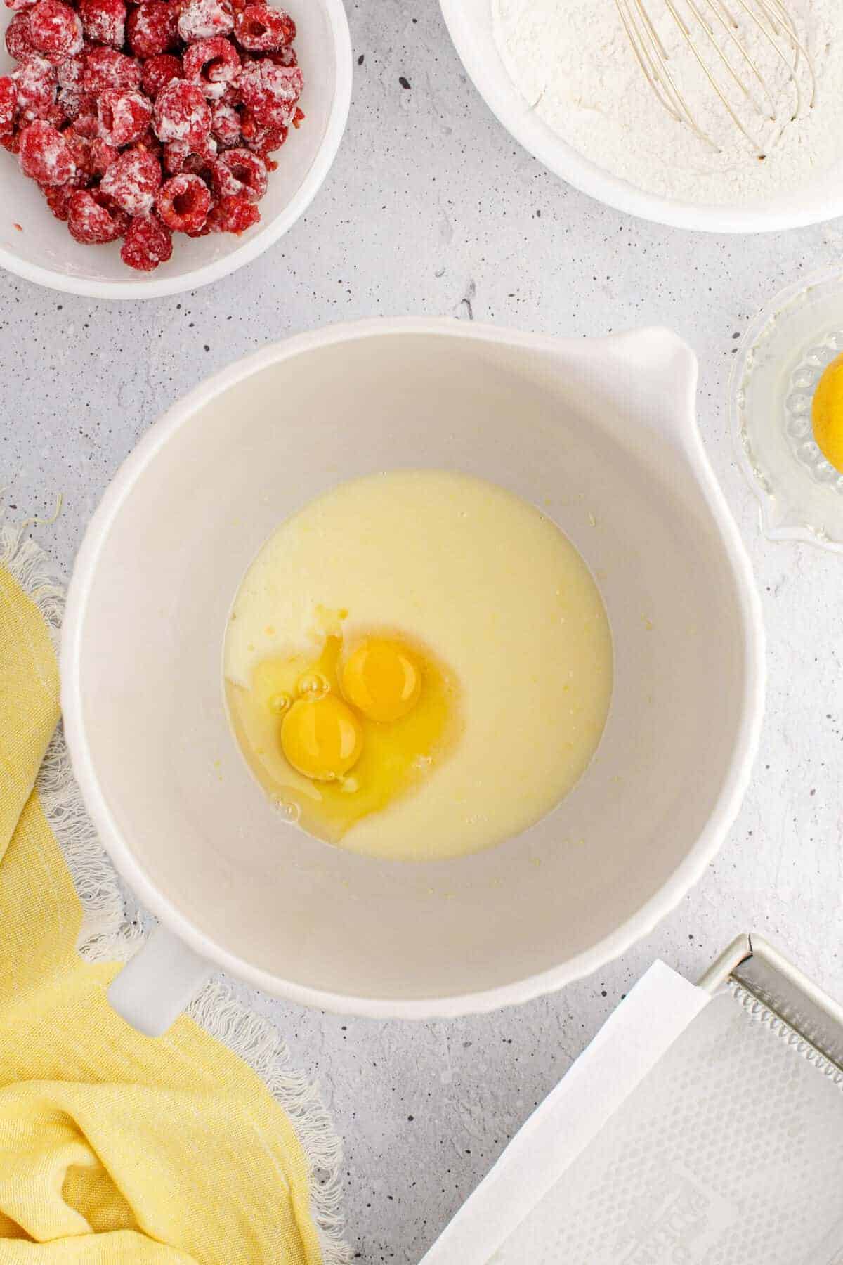 mixing bowl with eggs, butter, and other cake ingredients.