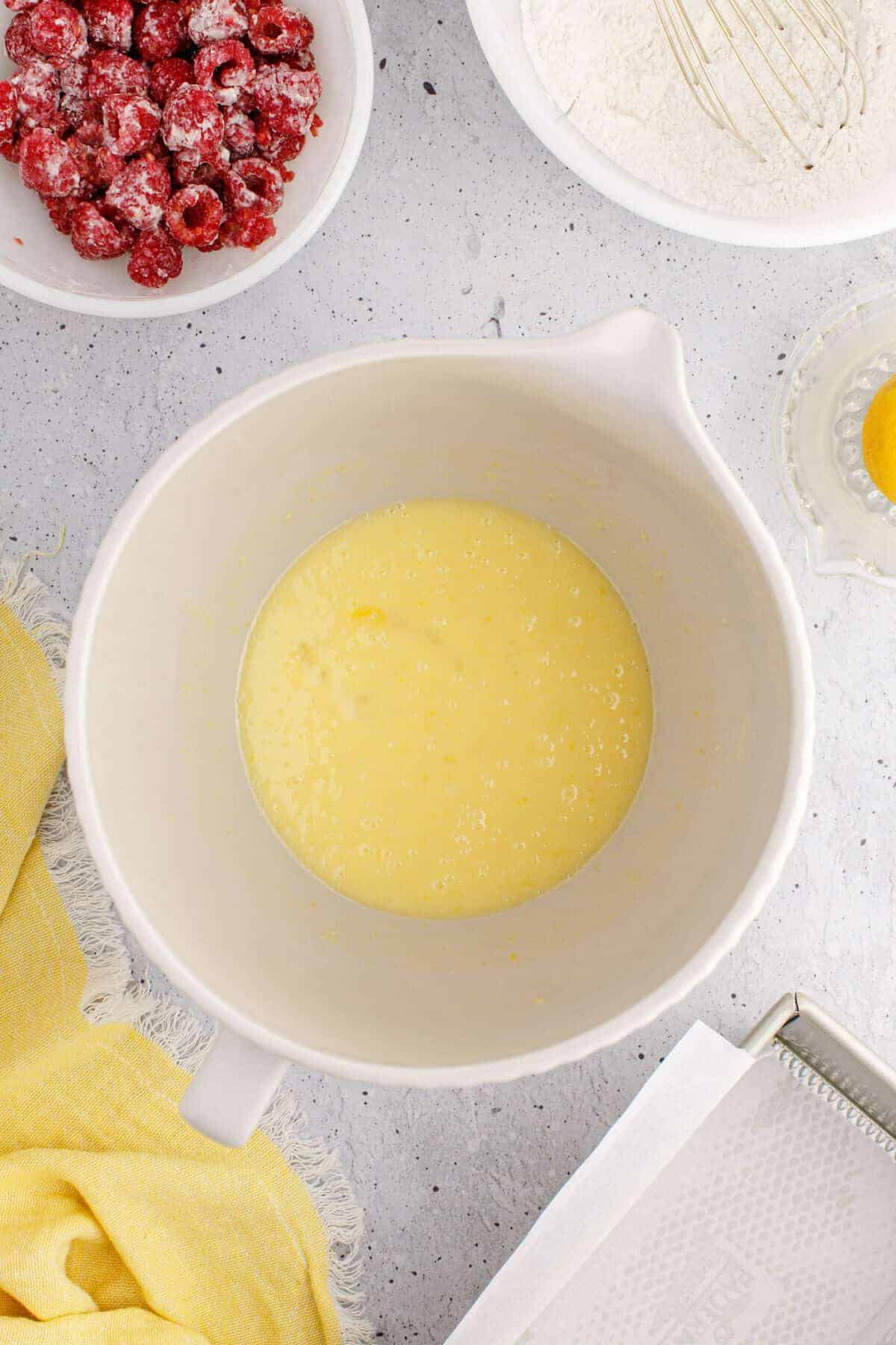 all of the custard like ingredients combined in a mixing bowl.