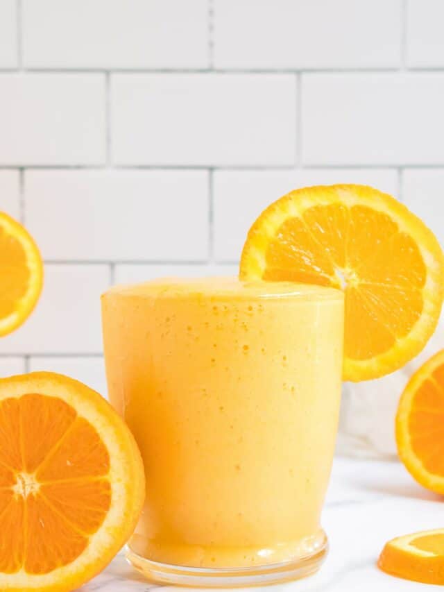 glass of orange mango smoothie.