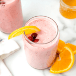 close up of a cranberry smoothie in a glass.