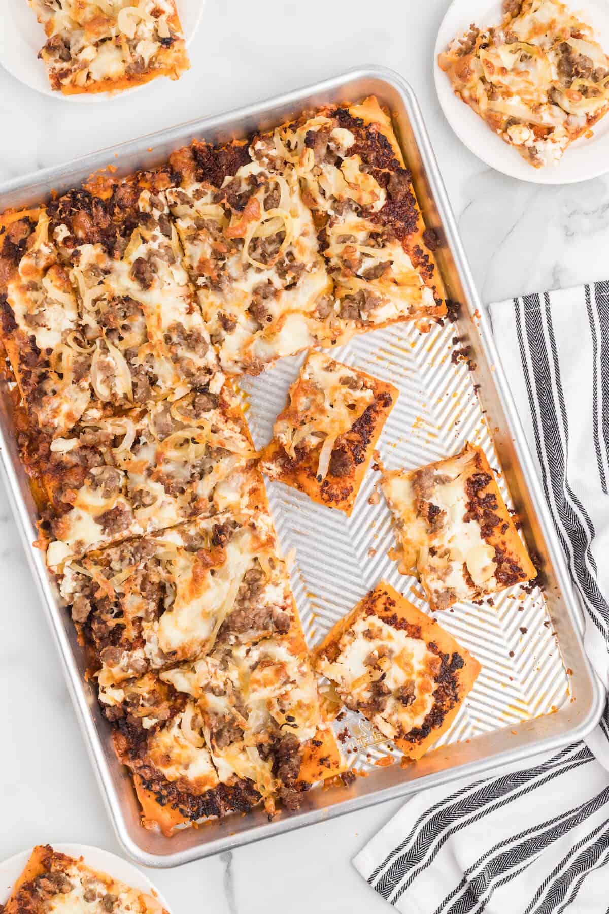 baking sheet with slices of sun dried tomato pizza