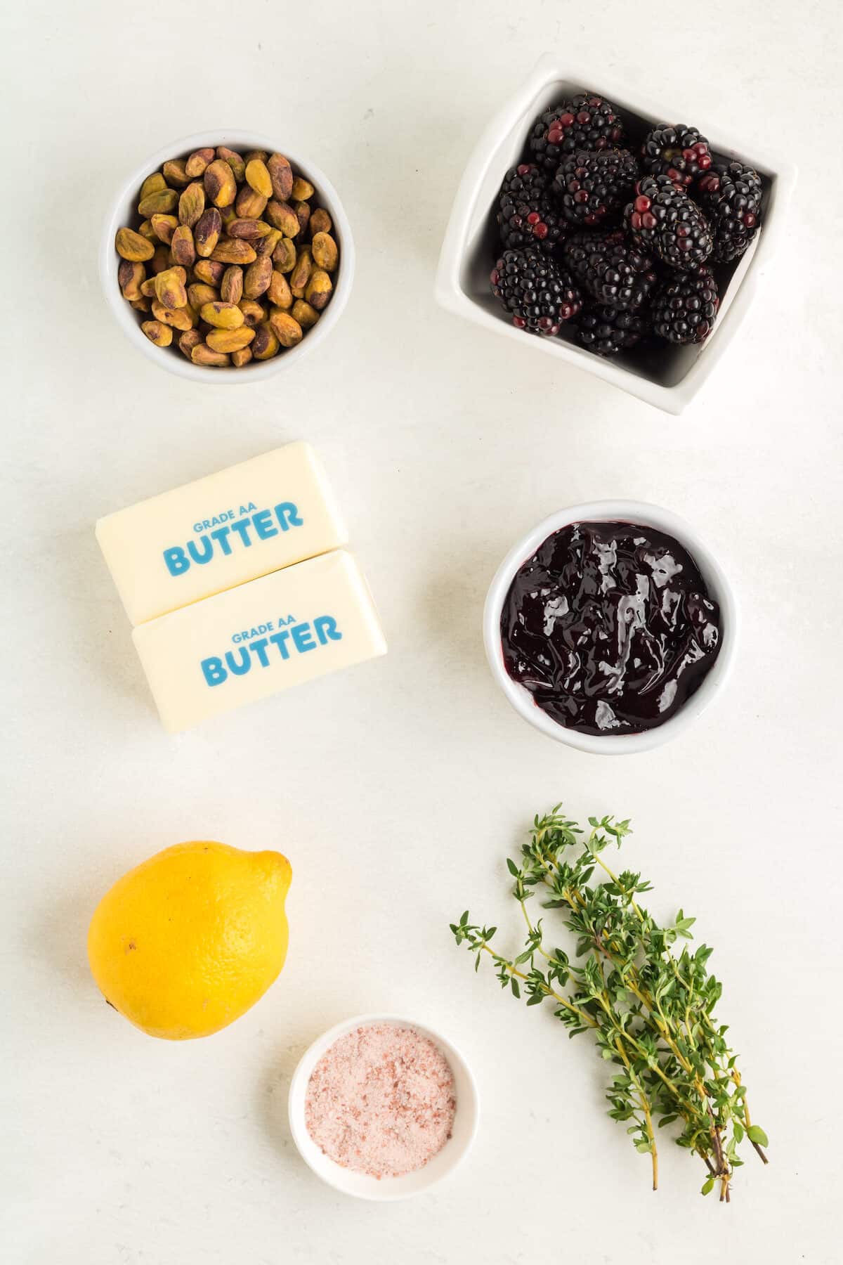 ingredients for the blackberry butter board in small plates.