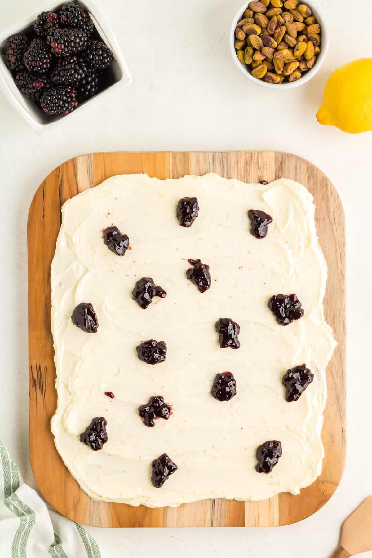 blackberry preserves dolloped over the butter spread.