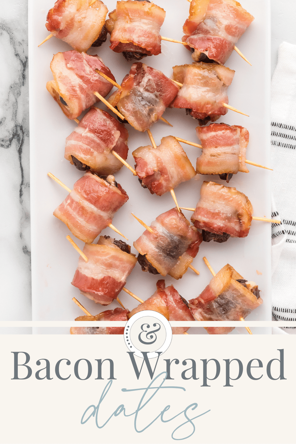 white tray of bacon wrapped dates with cheese.