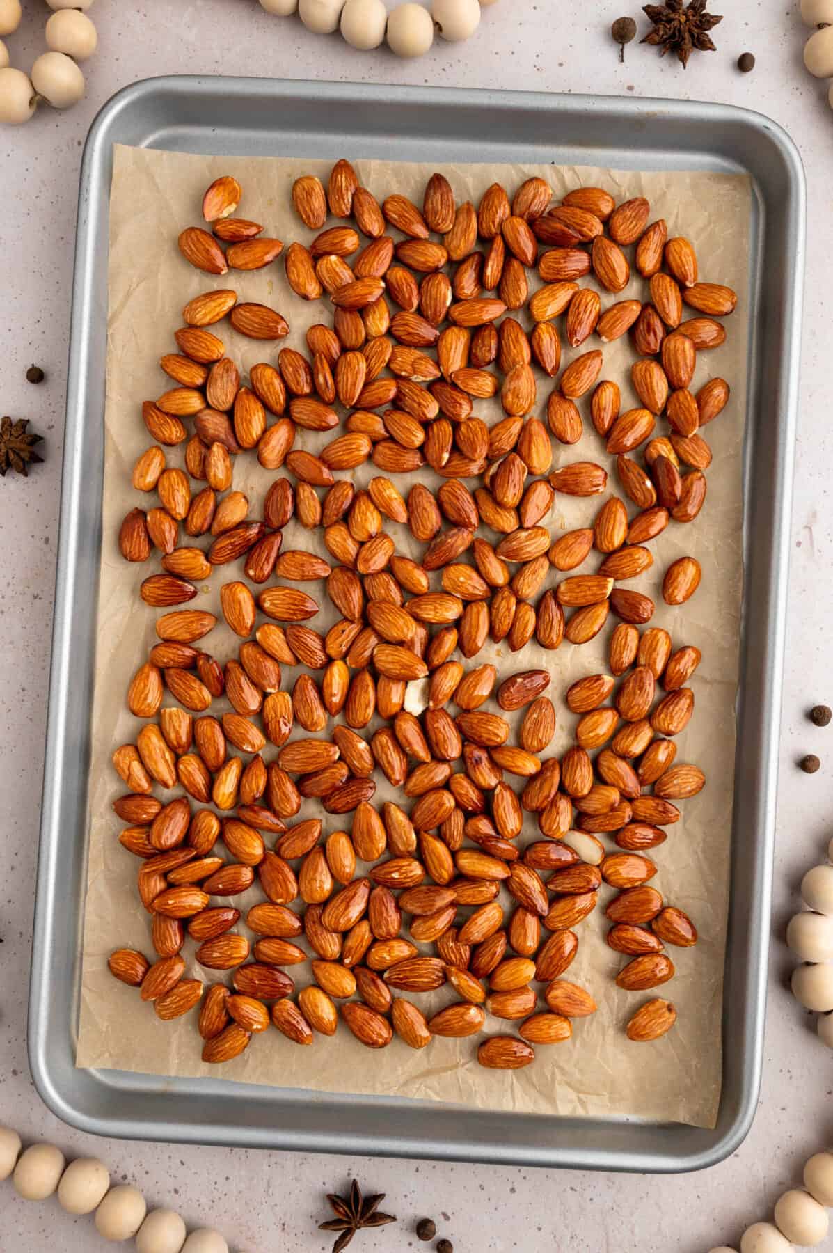 almonds on a parchment paper lined baking sheet.