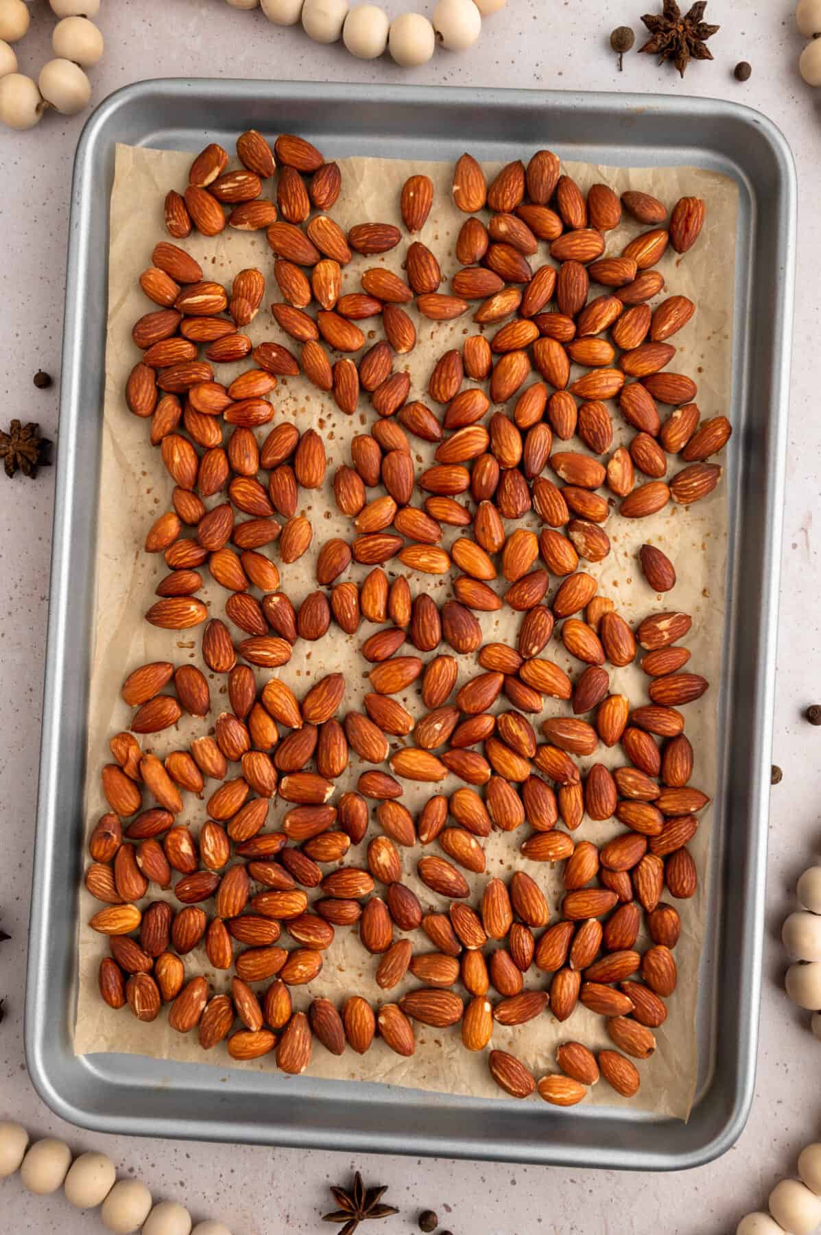 roasted almonds on the baking sheet with parchment paper.