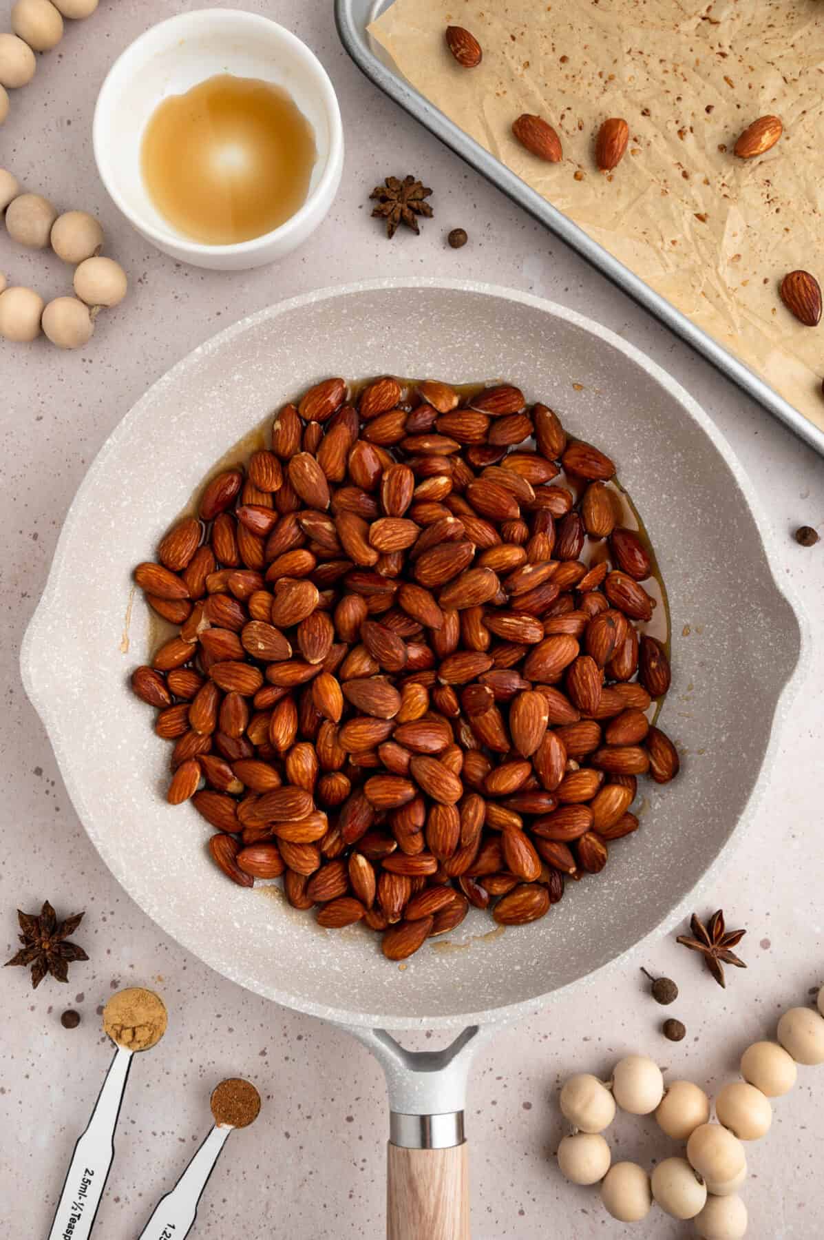 roasted almonds added to the skillet with the maple syrup.