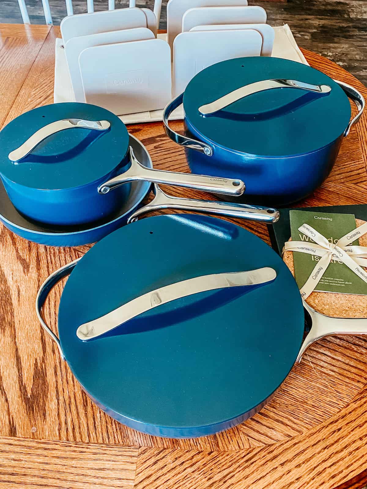 caraway home cookware set on a tabletop. 