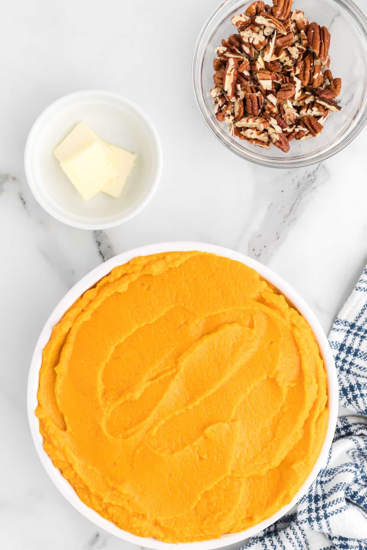 healthy mashed sweet potatoes in a large white serving bowl. 