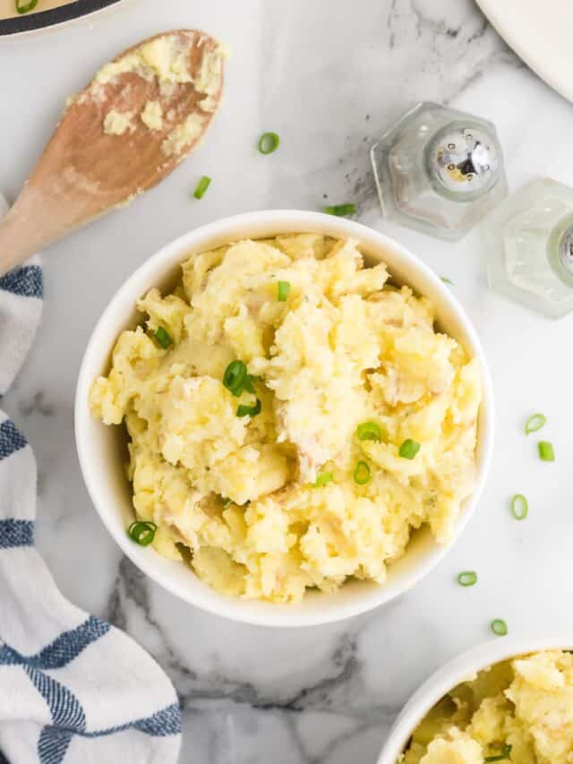 two white bowls of Boursin mashed potatoes.