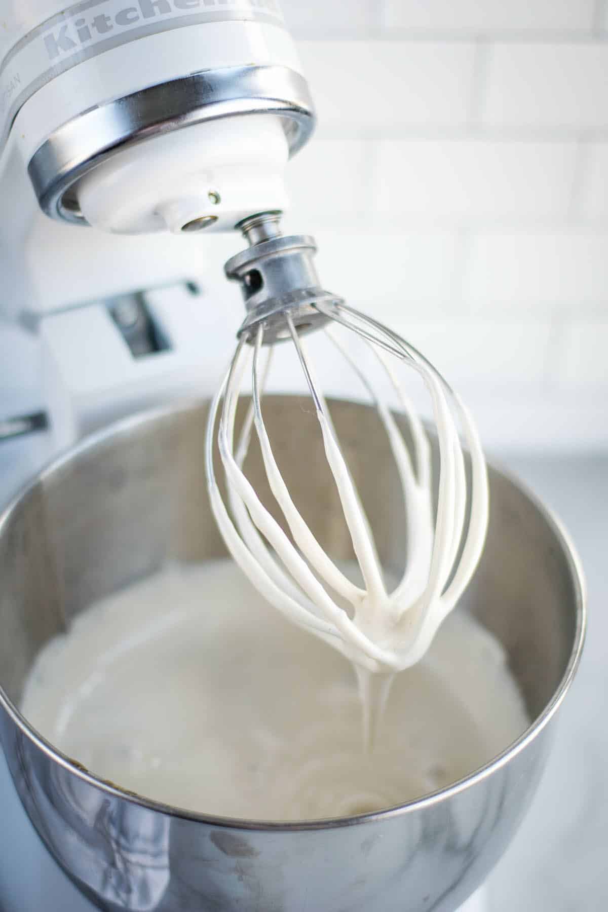 stand mixer with the marshmallow cream on a whisk attachment. 