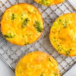 wire cooling rack with egg muffin cups cooling over top.