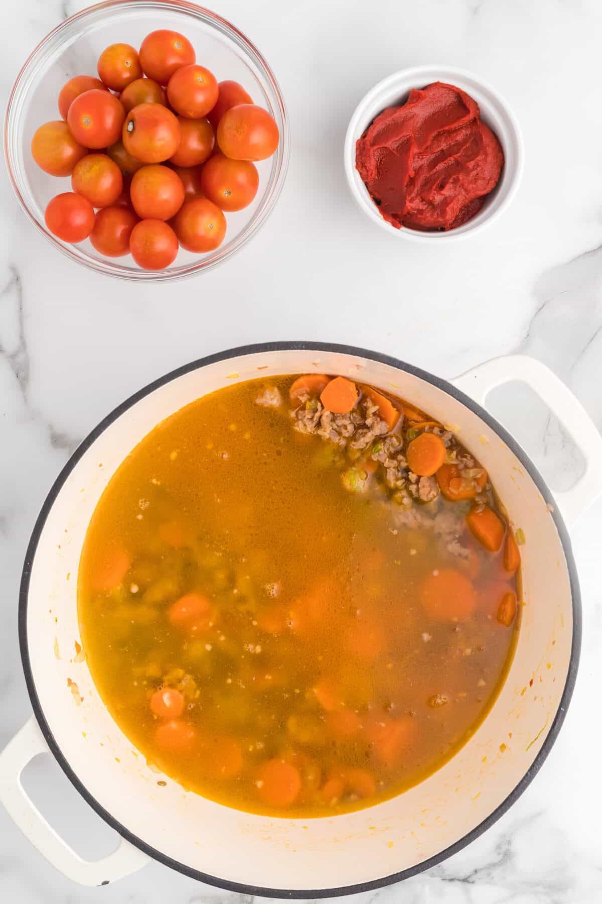 chicken broth added to the dutch oven with the italian sausage and vegetables.