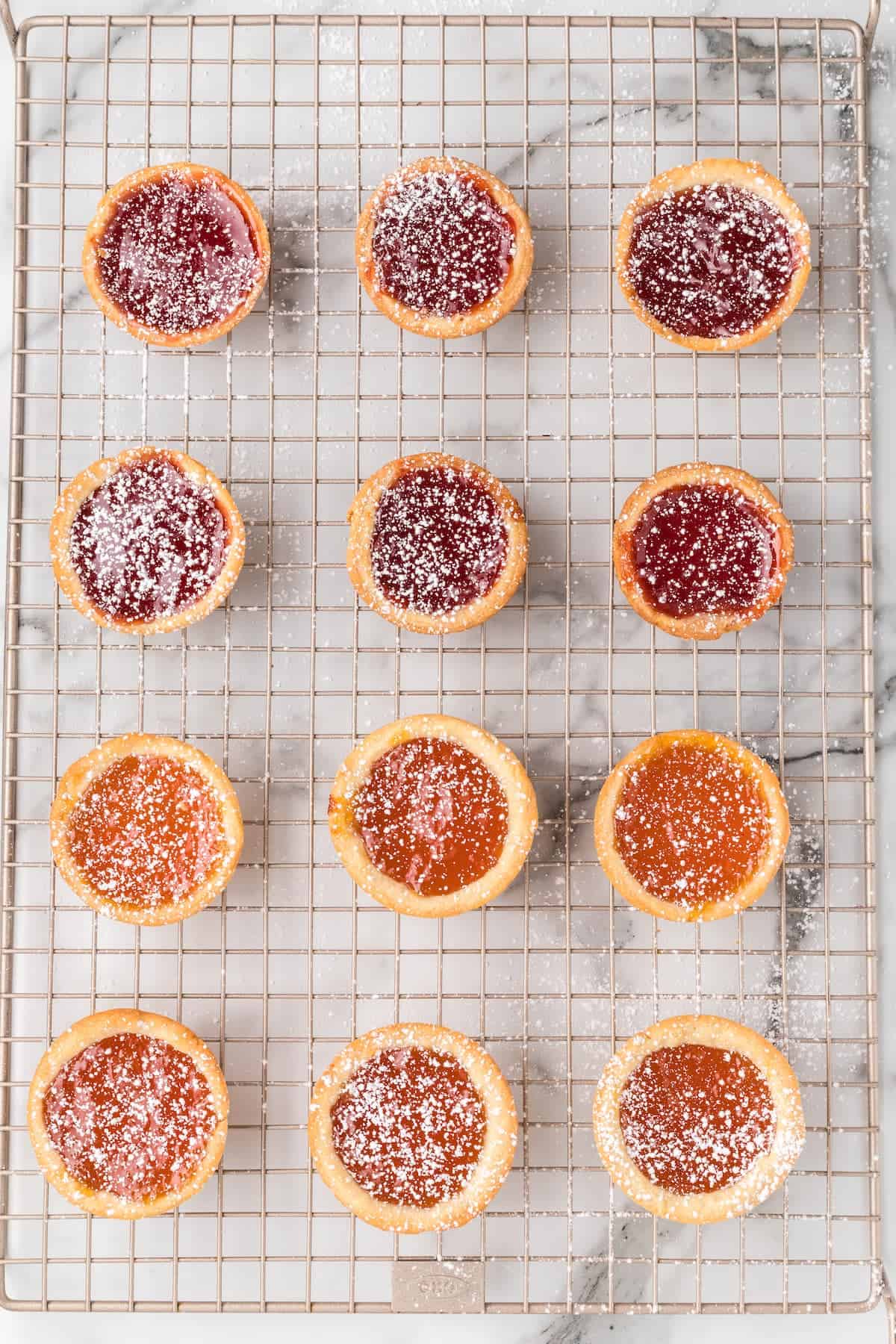 jam tarts lightly dusted with powdered sugar.