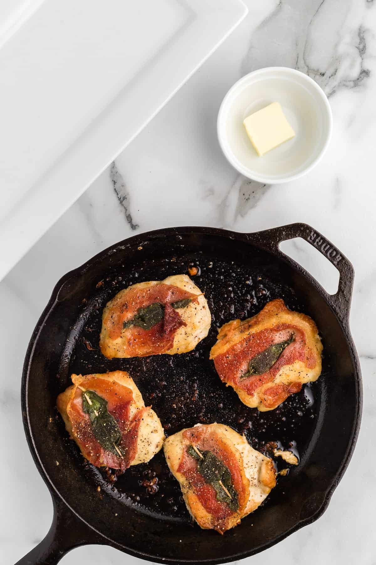 cooked chicken cutlets in the cast iron skillet.
