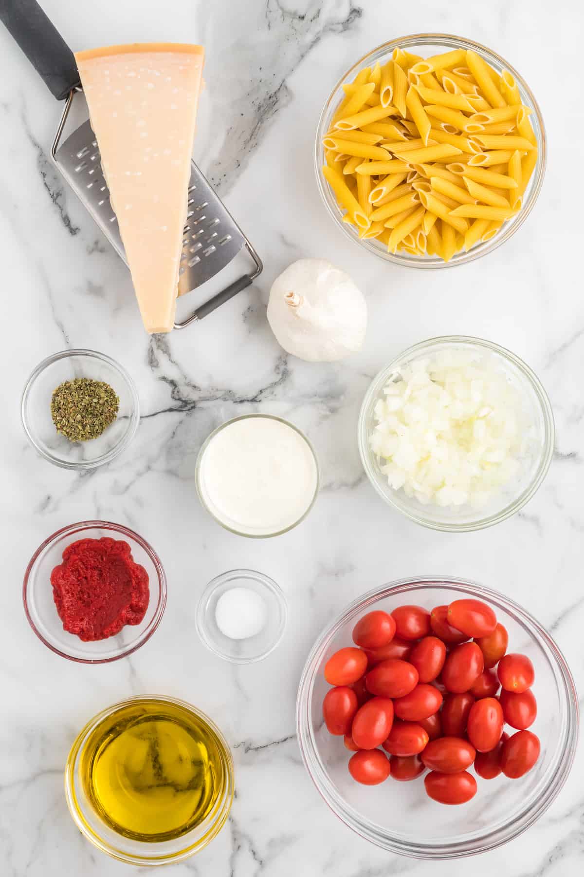 ingredients for the creamy pomodoro sauce in small bowls.