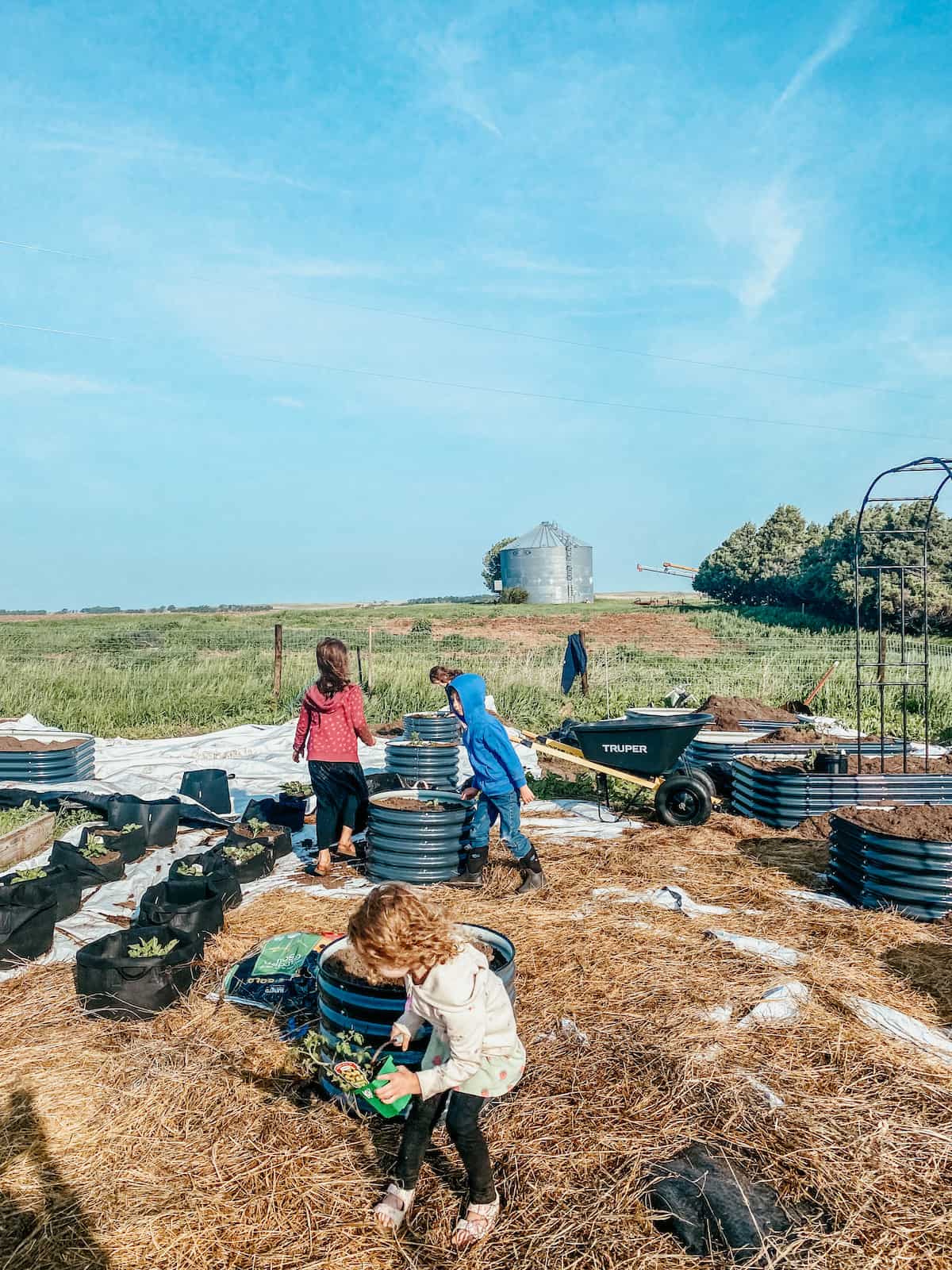 children working the garden.