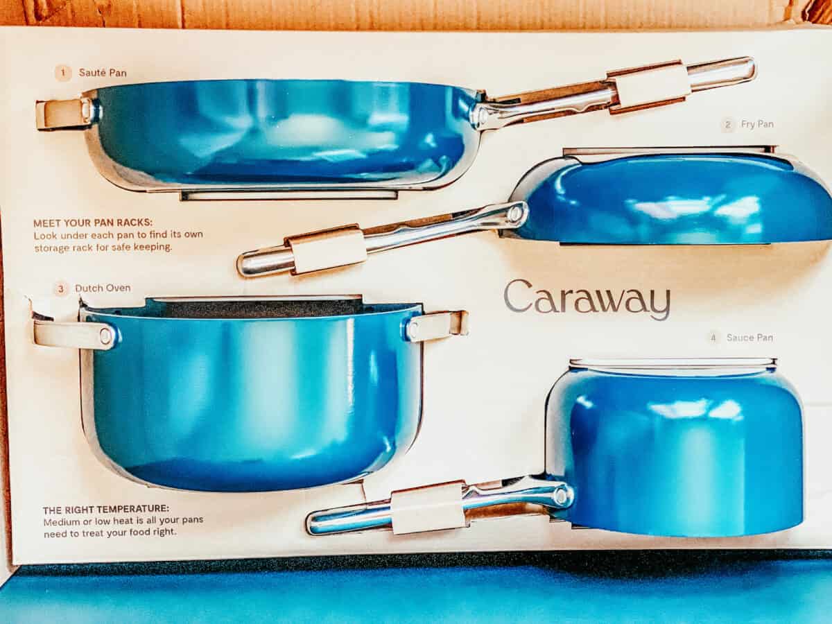 Caraway Home cookware set in the cardboard box.