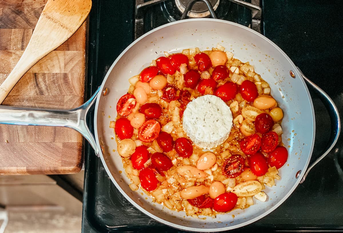 caraway home cookware with tomatoes and cheese block 