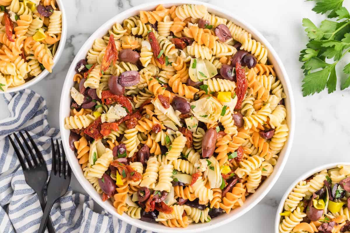 Mediterranean pasta salad in a serving white bowls.