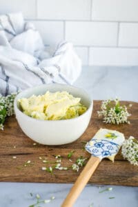 chive blossom butter in a small white bowl.