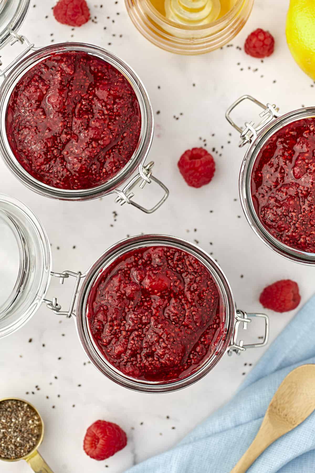 glass jars filled with berry chia seed jam. 