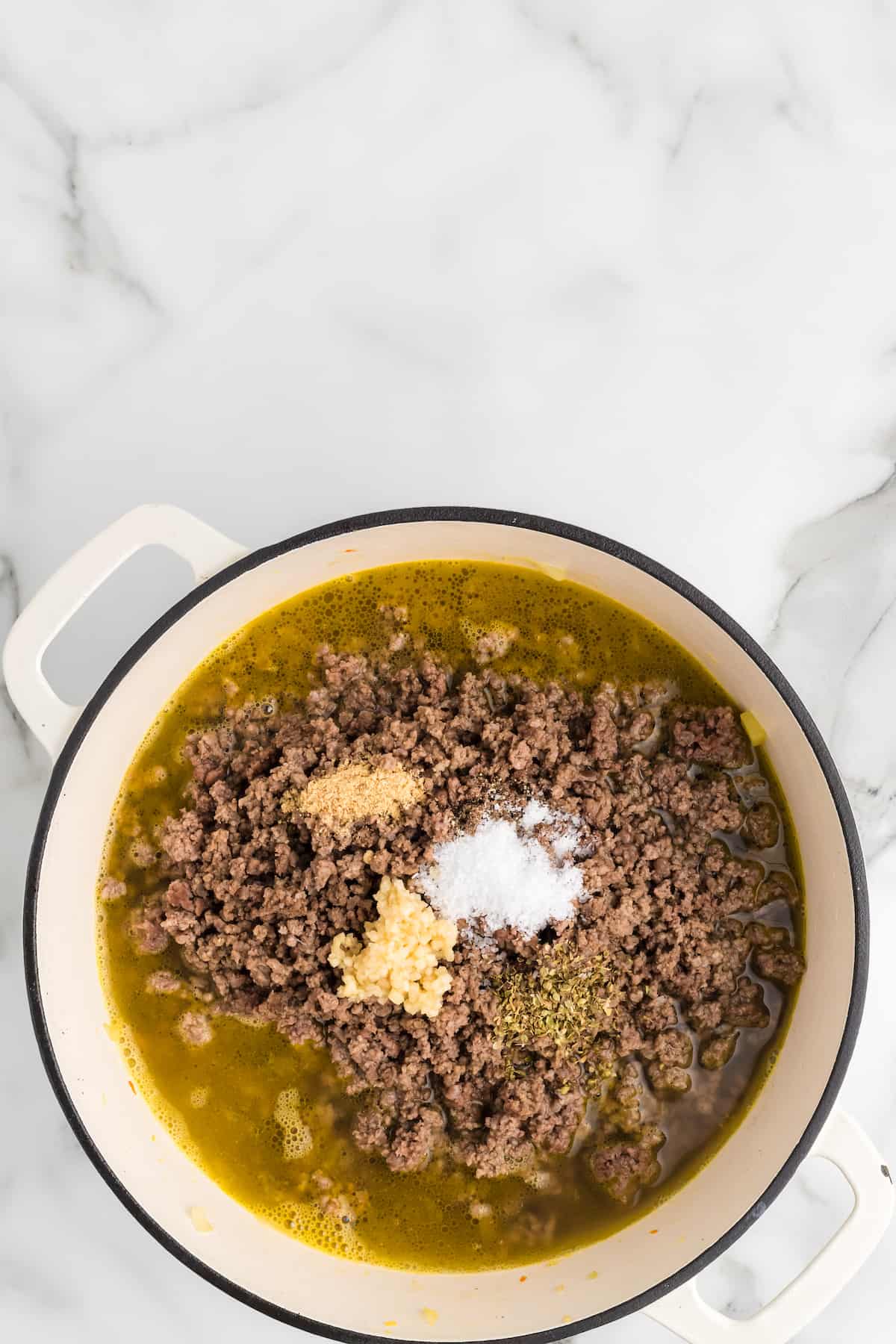 cooked ground beef with broth and seasonings. 