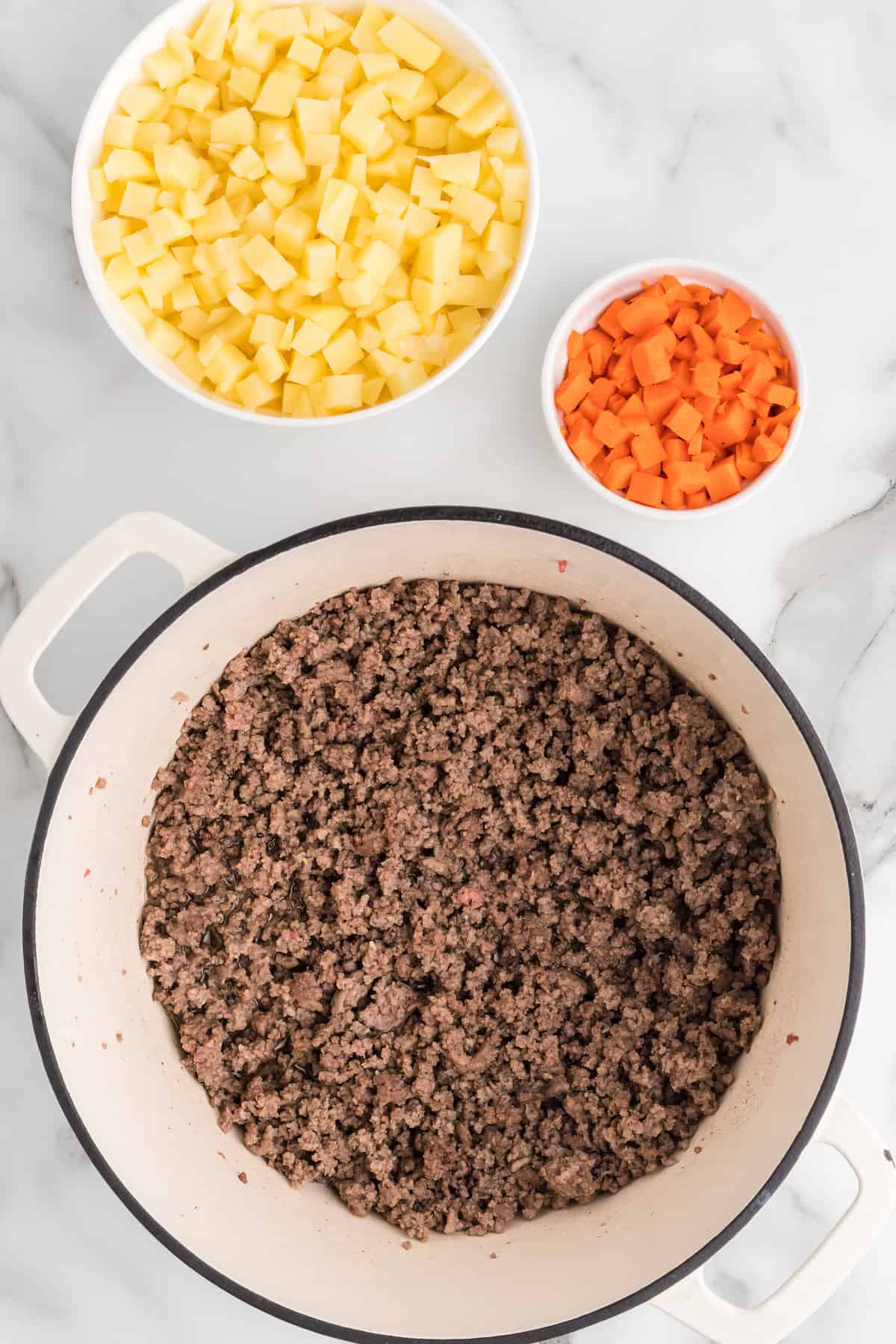 cooked ground beef in large pan.