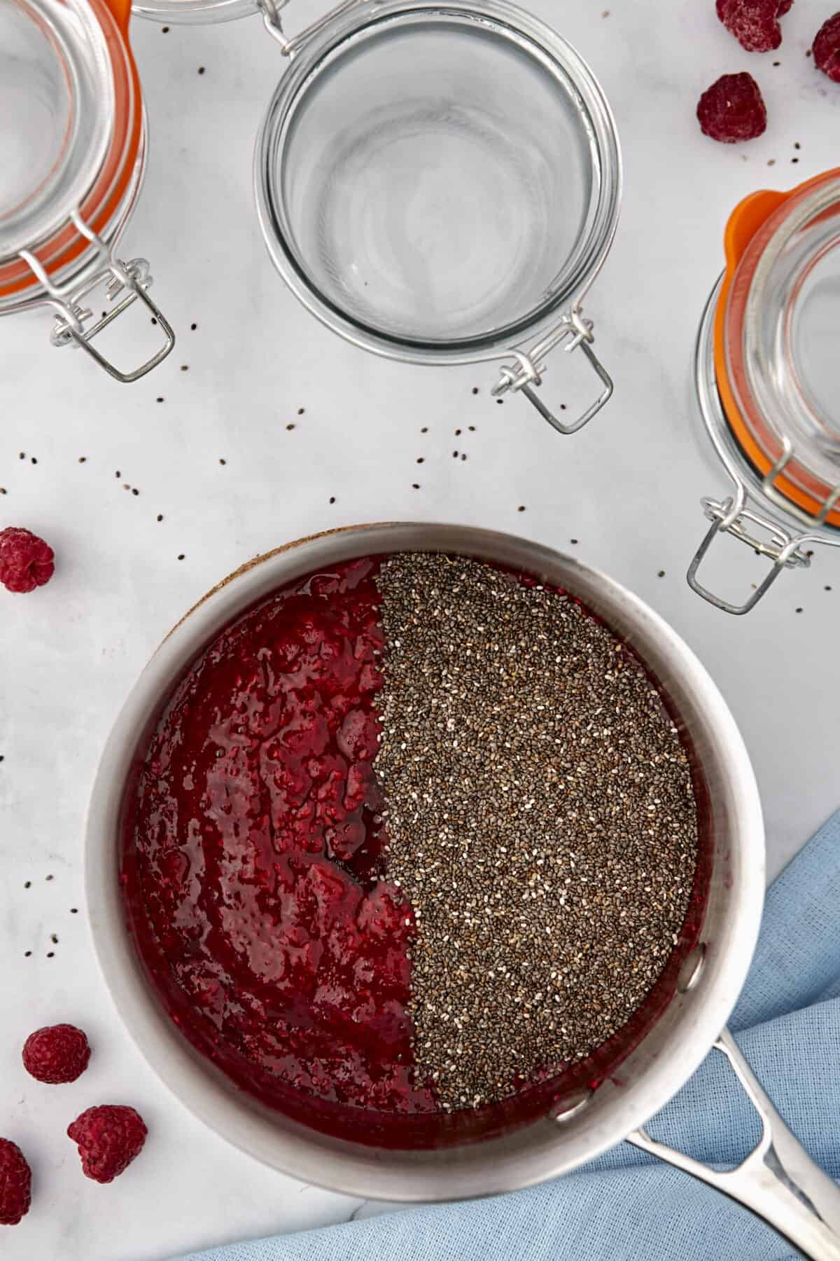 chia seeds added to the sauce pan with the raspberries.