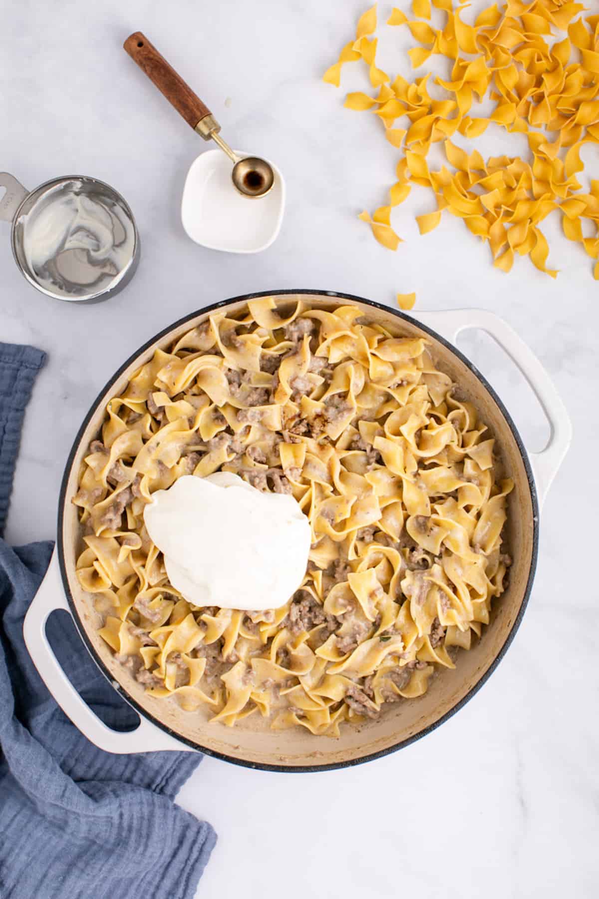 sour cream added to the stroganoff in a large skillet.