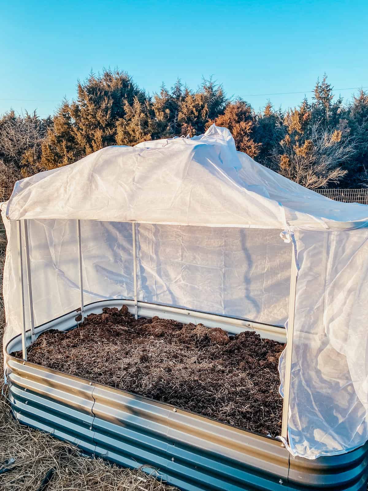 net cover system on the arch frame for the Vegega raised beds.