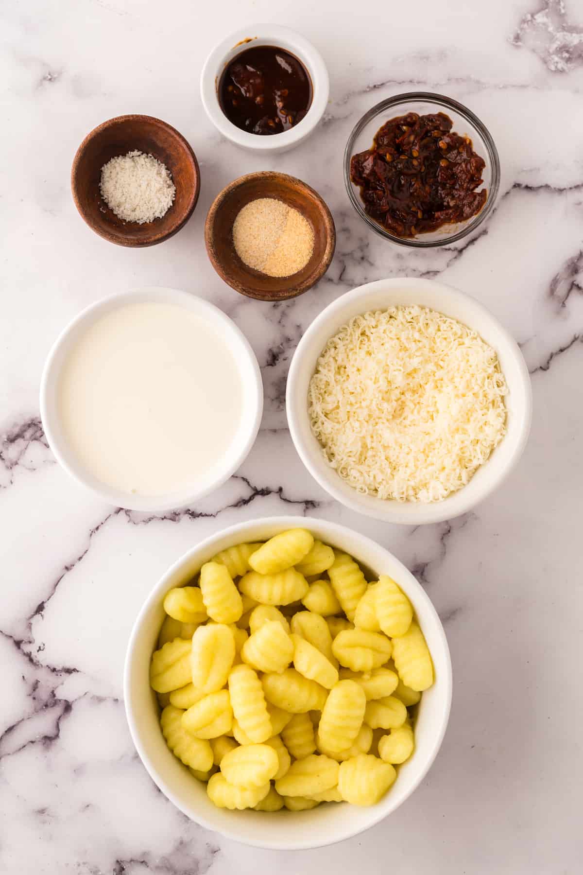 ingredients for the spicy gnocchi in small bowls. 