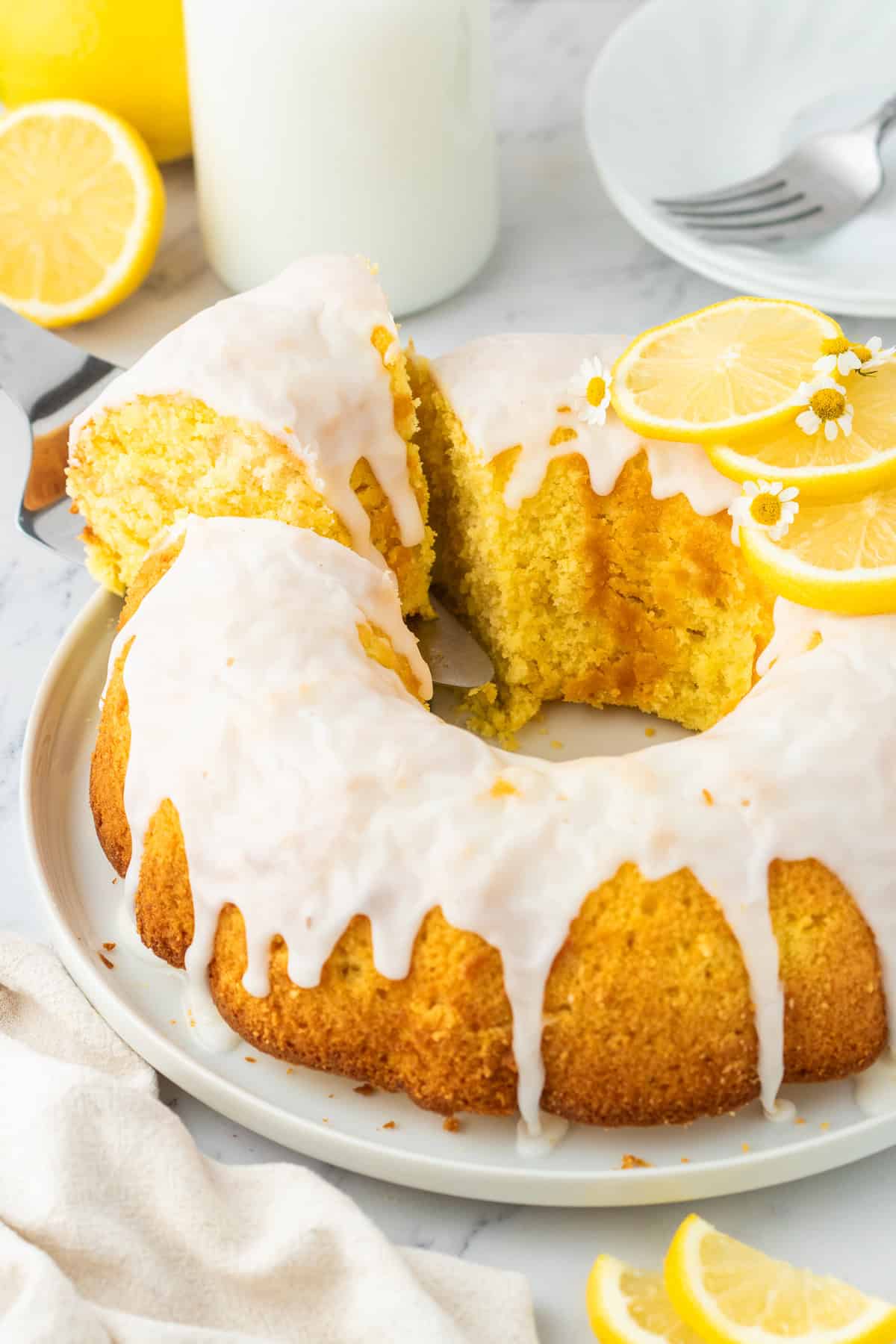 slice of lemon bundt cake on a serving spatula. 