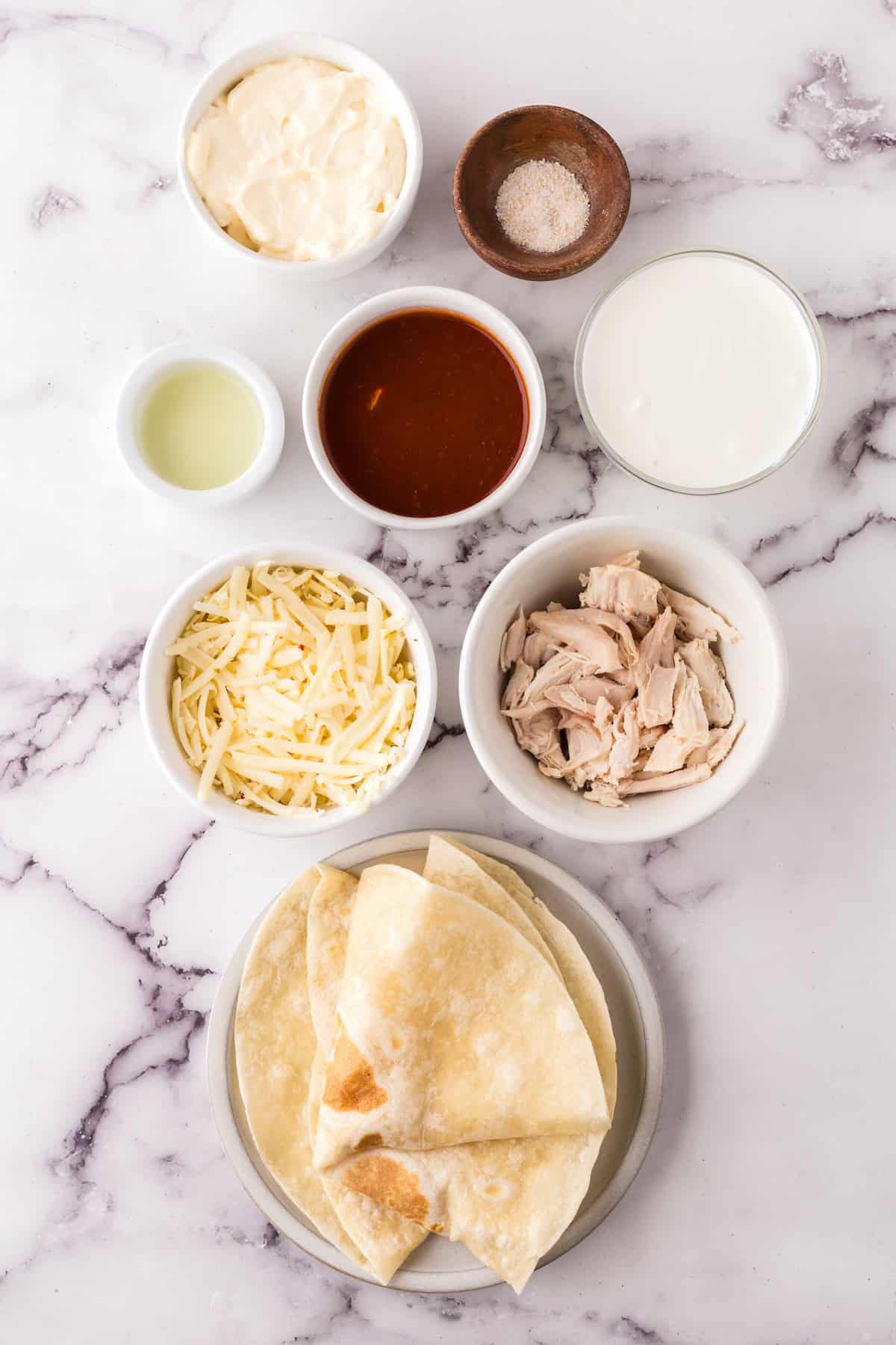ingredients for the chicken chipotle quesadillas in small bowls. 