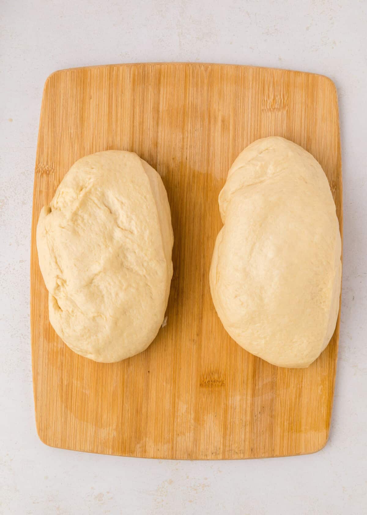 dough divided and shaped into loaves. 