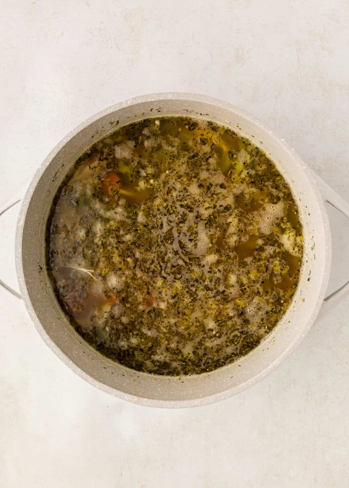 broth and dried herbs added to the chicken gnocchi soup. 