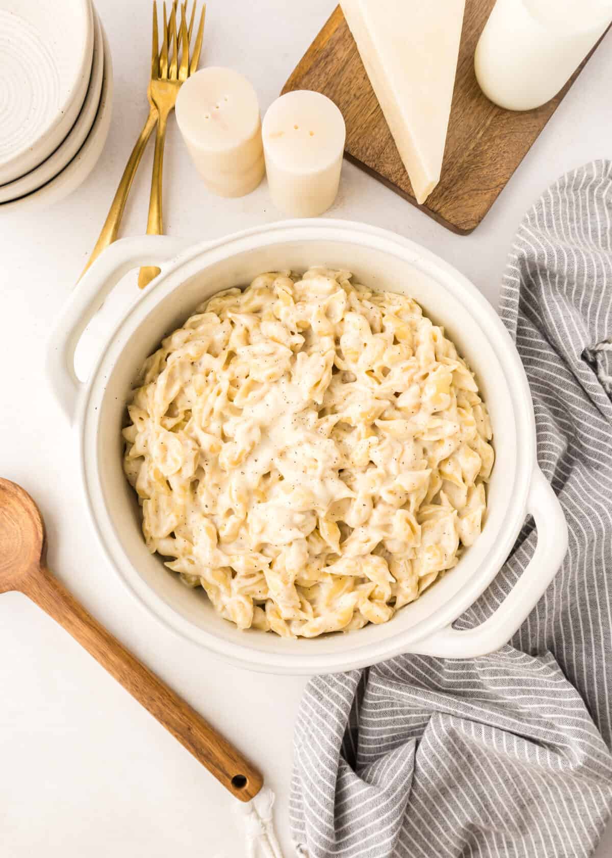 finished white cheddar Mac and cheese in a white pot. 