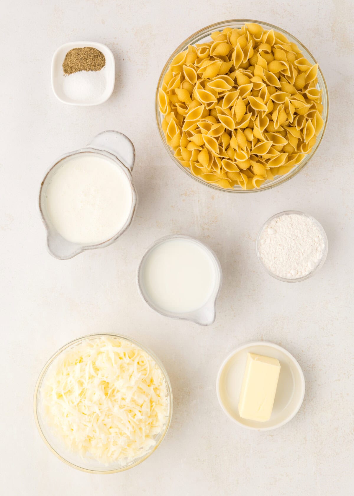 ingredients for the white cheddar Mac and cheese in small bowls. 